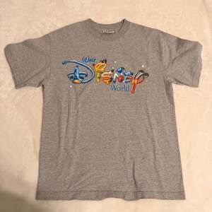 Vintage Walt Disney World Mickey Inc. Blue Spell Out Graphic T-Shirt